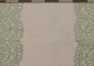 White fabric with mint green floral lace stripe borders